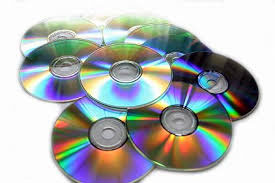 image of a pile of compact discs showing rainbow colours