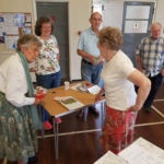 horticultural show officials discussing the outcome of the judging